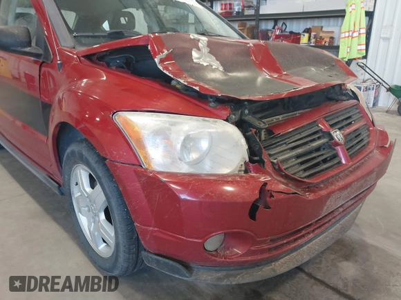 2009 Dodge Caliber SXT with VIN 1B3HB48A79D108706, listed as a IAAI auction lot 41555213 with 159,577 mi miles and . Bid and sale history available at DreamBid. Image 12.