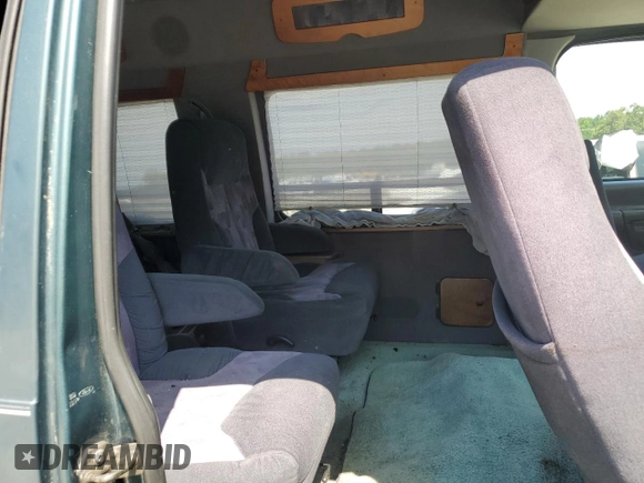 1997 Ford Econoline Commercial z VIN 1FDEE1466VHB91990, wystawiony jako Copart lot #63201564 z przebiegiem 216 793 mil mil oraz Szkody całkowita. Historia ofert i sprzedaży dostępna na DreamBid. Obrazek 11.