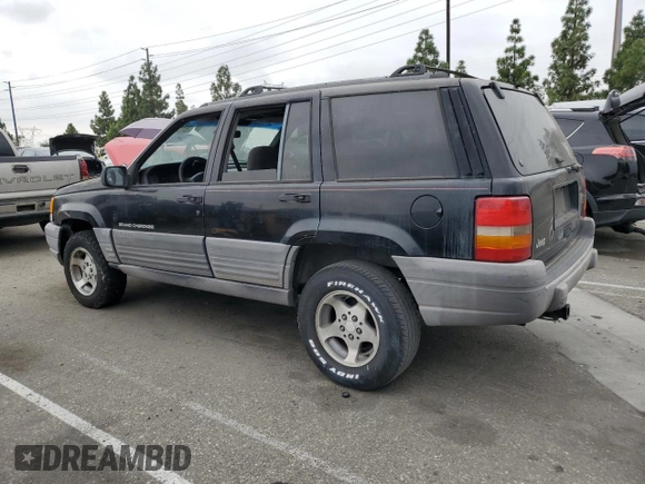 1998 Jeep Grand Cherokee Laredo with VIN 1J4FX58S0WC305329, listed as a Copart auction lot 76777264 with 251,942 mi miles and Clean Title. Bid and sale history available at carsss.com. Image 2.