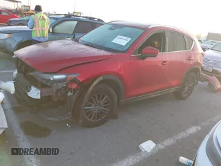 2020 Mazda CX-5 Touring z VIN JM3KFACM1L0855474, wystawiony jako IAAI lot #42004504 z przebiegiem 82 505 mil mil oraz . Historia ofert i sprzedaży dostępna na DreamBid. Obrazek 2.