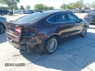 2019 Ford Fusion Hybrid Titanium with VIN 3FA6P0RU2KR123786, listed as a IAAI auction lot 41857026 with 49,604 mi miles. Bid and sale history available at carsss.com. Image 4.