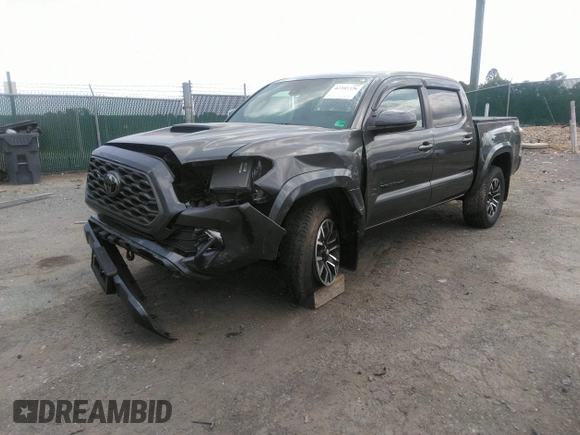 2021 Toyota Tacoma SR z VIN 3TYCZ5AN7MT017377, wystawiony jako IAAI lot #42285326 z przebiegiem 91 657 mil mil oraz . Historia ofert i sprzedaży dostępna na DreamBid. Obrazek 2.