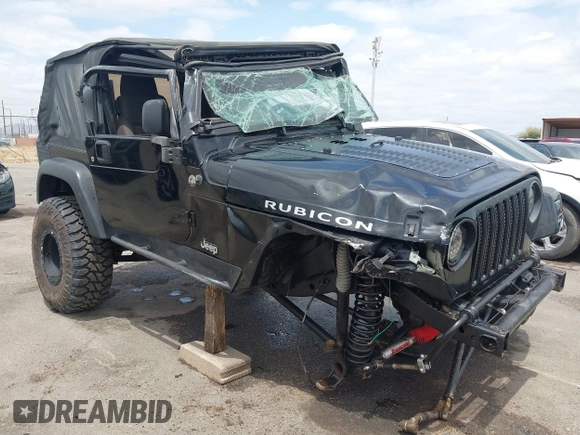 2004 Jeep Wrangler Rubicon z VIN 1J4FA69S84P727716, wystawiony jako IAAI lot #42162129 z przebiegiem 90 844 mil mil oraz . Historia ofert i sprzedaży dostępna na DreamBid. Obrazek 1.