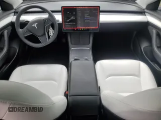 2023 Tesla Model 3 with VIN 5YJ3E1EA3PF672023, listed as a Copart auction lot 57571645 with 18,115 mi miles and Salvage title. Bid and sale history available at DreamBid. Image 8.
