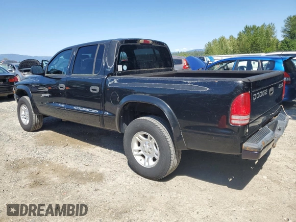 2001 Dodge Dakota Sport z VIN 1B7GG2AN81S113605, wystawiony jako Copart lot #58990065 z przebiegiem 243 919 mil mil oraz Czysty tytuł • Clean title. Historia ofert i sprzedaży dostępna na DreamBid. Obrazek 2.
