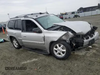 2004 GMC Envoy SLE with VIN 1GKDS13S142358446, listed as a Copart auction lot 43383935 with 154,358 mi miles and Salvage Title. Bid and sale history available at carsss.com. Image 4.