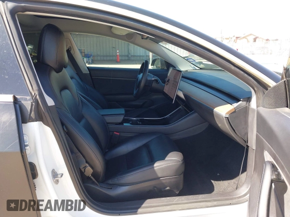 2020 Tesla Model 3 Standard Range Plus with VIN 5YJ3E1EA0LF597761, listed as a IAAI auction lot 41773918 with 89,957 mi miles. Bid and sale history available at carsss.com. Image 5.