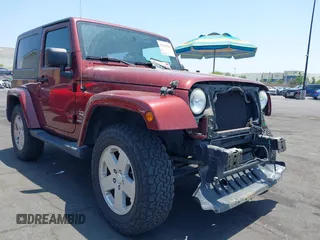 2010 Jeep Wrangler Sahara z VIN 1J4AA5D14AL125062, wystawiony jako IAAI lot #42418736 z przebiegiem 90 839 mil mil oraz . Historia ofert i sprzedaży dostępna na DreamBid. Obrazek 1.