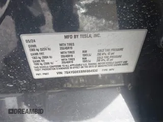 2024 Tesla Model Y Long Range with VIN 7SAYGDEE8RF084936, listed as a IAAI auction lot 41615104 with 14,622 mi miles. Bid and sale history available at carsss.com. Image 9.