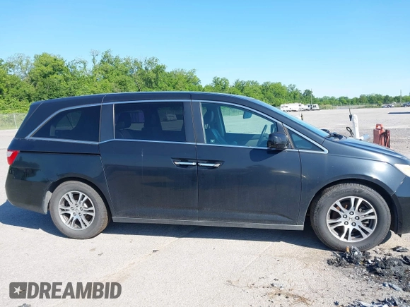 2011 Honda Odyssey EX-L with VIN 5FNRL5H66BB058333, listed as a IAAI auction lot 42172045 with 215,723 mi miles and . Bid and sale history available at carsss.com. Image 13.