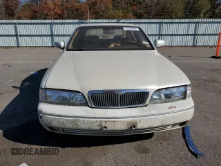 1994 Infiniti Q45 z VIN JNKNG01D3RM252218, wystawiony jako Copart lot #77230944 z przebiegiem 69 069 mil mil oraz Tytuł czysty. Historia ofert i sprzedaży dostępna na DreamBid. Obrazek 5.