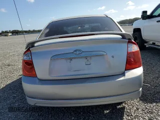 2006 Kia Spectra EX with VIN KNAFE121365229594, listed as a Copart auction lot 77311084 with 129,789 mi miles and Salvage Title. Bid and sale history available at carsss.com. Image 6.