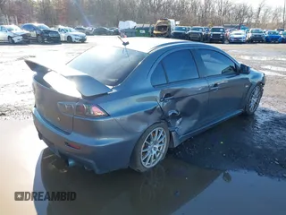 2008 Mitsubishi Lancer Evolution GSR with VIN JA3AW86V18U044077, listed as a IAAI auction lot 41208625 with 157,788 mi miles. Bid and sale history available at carsss.com. Image 4.