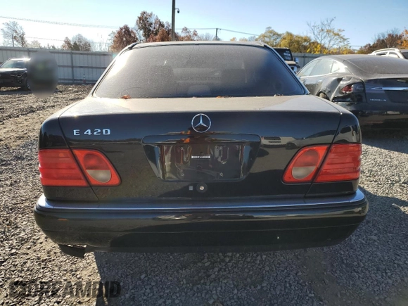 1997 Mercedes-Benz E-Class with VIN WDBJF72F0VA523161, listed as a Copart auction lot 77752804 with 143,495 mi miles and Salvage Title. Bid and sale history available at carsss.com. Image 6.
