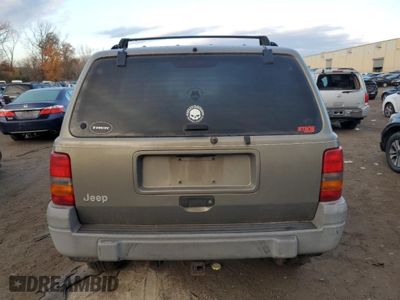 1997 Jeep Grand Cherokee Laredo with VIN 1J4GZ58S1VC741586, listed as a Copart auction lot 77619394 with 0 mi miles and Clean Title. Bid and sale history available at carsss.com. Image 6.