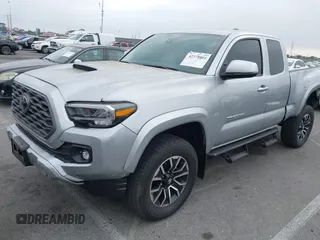 2022 Toyota Tacoma SR with VIN 3TYRZ5CN9NT022492, listed as a IAAI auction lot 42378801 with 9,312 mi miles and . Bid and sale history available at DreamBid. Image 2.