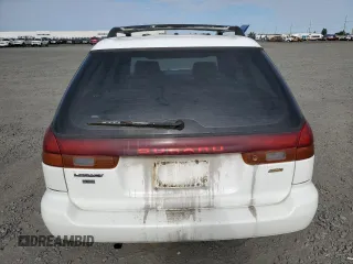 1997 Subaru Legacy L with VIN 4S3BK4359V7309059, listed as a Copart auction lot 59600835 with 136,620 mi miles and Salvage title. Bid and sale history available at DreamBid. Image 6.