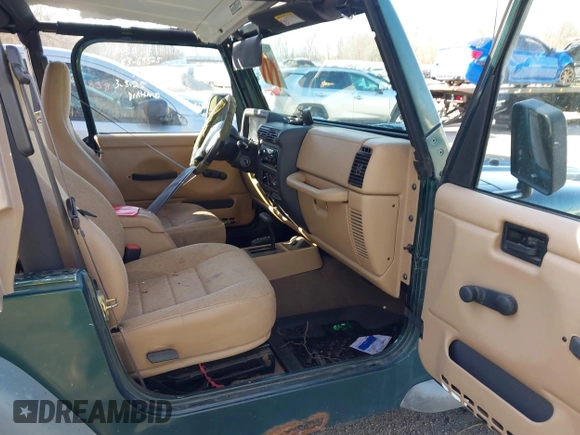 2001 Jeep Wrangler Sport with VIN 1J4FA49S31P317597, listed as a IAAI auction lot 41839524 with 145,164 mi miles. Bid and sale history available at carsss.com. Image 5.