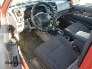 1999 Nissan Frontier XE with VIN 1N6ED26Y8XC342224, listed as a Copart auction lot 79815914 with 227,533 mi miles and Salvage title. Bid and sale history available at DreamBid. Image 8.