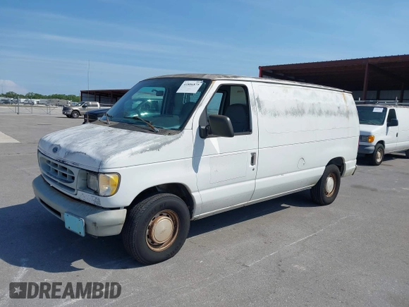 1999 Ford Econoline Cargo with VIN 1FTRE1428XHA20390, listed as a IAAI auction lot 41806875 with 207,954 mi miles. Bid and sale history available at carsss.com. Image 2.