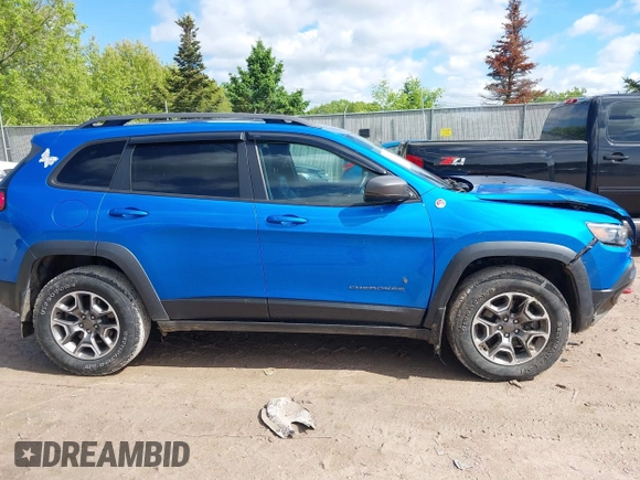 2020 Jeep Cherokee Trailhawk with VIN 1C4PJMBXXLD636547, listed as a IAAI auction lot 42314654 with 59,061 mi miles and . Bid and sale history available at DreamBid. Image 13.