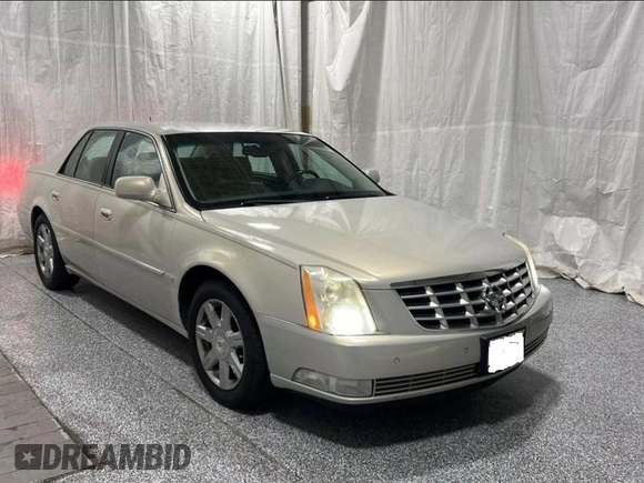 2007 Cadillac DTS V8 z VIN 1G6KD57Y27U198589, wystawiony jako Copart lot #59233755 z przebiegiem 171 023 mil mil oraz Tytuł czysty. Historia ofert i sprzedaży dostępna na DreamBid. Obrazek 1.