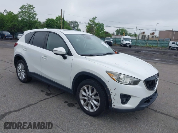 2015 Mazda CX-5 Grand Touring with VIN JM3KE4DY5F0530854, listed as a IAAI auction lot 42274582 with 144,732 mi miles and . Bid and sale history available at DreamBid. Image 1.