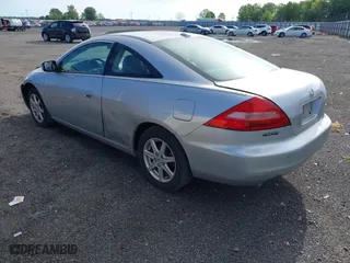 2004 Honda Accord Cpe EX with VIN 1HGCM82664A010907, listed as a IAAI auction lot 42086599 with 215,595 mi miles. Bid and sale history available at carsss.com. Image 3.