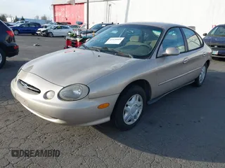 1999 Ford Taurus SE with VIN 1FAFP53U4XG223246, listed as a IAAI auction lot 41570969 with 59,064 mi miles. Bid and sale history available at carsss.com. Image 2.
