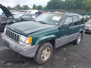 1996 Jeep Grand Cherokee with VIN 1J4EZ58Y7TC128302, listed as a IAAI auction lot 42643449 with 282,036 mi miles and . Bid and sale history available at DreamBid. Image 2.