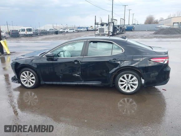 2019 Toyota Camry LE with VIN 4T1B11HK2KU263910, listed as a IAAI auction lot 42060008 with 31,433 mi miles and . Bid and sale history available at DreamBid. Image 14.