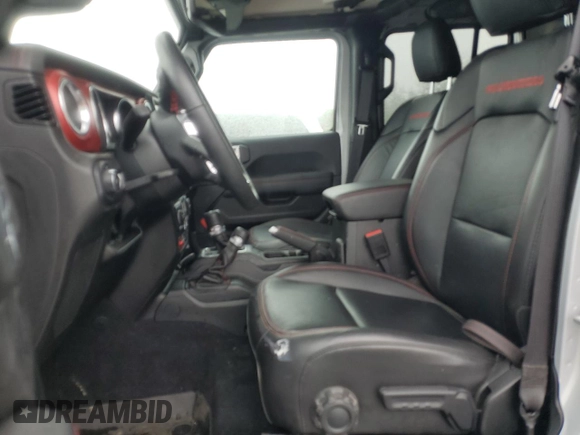 2023 Jeep Wrangler Rubicon with VIN 1C4JJXFM4PW589923, listed as a Copart auction lot 58725465 with 9,814 mi miles and Salvage title. Bid and sale history available at DreamBid. Image 7.