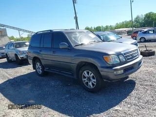 2003 Lexus LX with VIN JTJHT00W233532297, listed as a IAAI auction lot 42189676 with 235,992 mi miles. Bid and sale history available at carsss.com. Image 1.