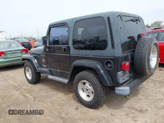 2001 Jeep Wrangler Sahara with VIN 1J4FA59S81P321733, listed as a IAAI auction lot 42164863 with 174,509 mi miles. Bid and sale history available at carsss.com. Image 3.