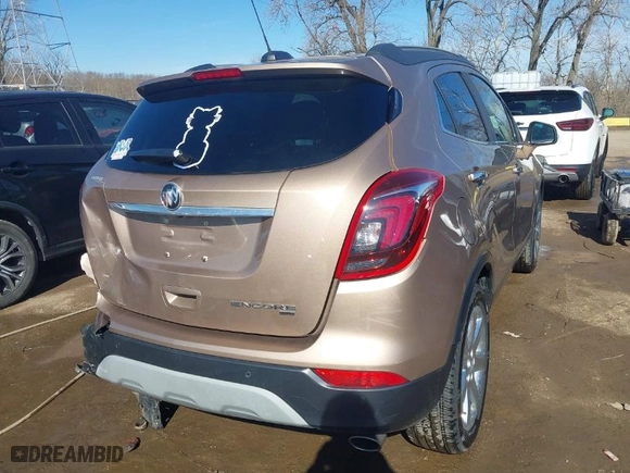 2019 Buick Encore Essence with VIN KL4CJGSM8KB861415, listed as a IAAI auction lot 41675619 with 51,555 mi miles. Bid and sale history available at carsss.com. Image 4.