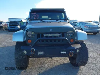 2010 Jeep Wrangler Unlimited Sahara with VIN 1J4BA5H14AL230604, listed as a IAAI auction lot 41884346 with 97,060 mi miles. Bid and sale history available at carsss.com. Image 12.