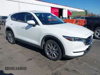 2021 Mazda CX-5 Grand Touring with VIN JM3KFBDM6M0483135, listed as a IAAI auction lot 41590430 with 33,466 mi miles. Bid and sale history available at carsss.com. Image 1.