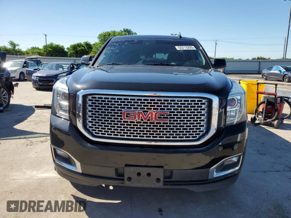 2015 GMC Yukon Denali z VIN 1GKS1CKJ8FR748131, wystawiony jako Copart lot #55213205 z przebiegiem 101 758 mil mil oraz Szkoda całkowita • Salvage title. Historia ofert i sprzedaży dostępna na DreamBid. Obrazek 5.