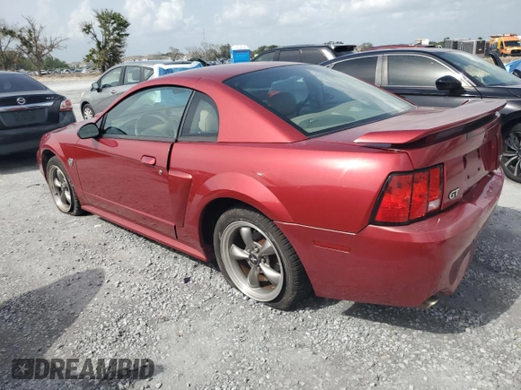 2004 Ford Mustang GT Deluxe with VIN 1FAFP42X64F174672, listed as a Copart auction lot 59902025 with 83,386 mi miles and Salvage title. Bid and sale history available at DreamBid. Image 2.
