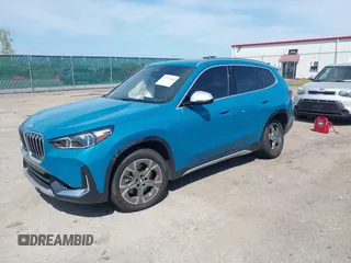 2023 BMW X1 xDrive28i with VIN WBX73EF00P5W52935, listed as a IAAI auction lot 42221084 with 16,394 mi miles and . Bid and sale history available at DreamBid. Image 2.