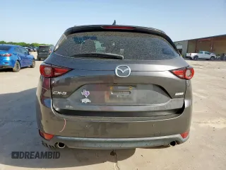 2019 Mazda CX-5 Grand Touring with VIN JM3KFADM8K1634011, listed as a Copart auction lot 57343455 with 67,138 mi miles and Salvage title. Bid and sale history available at DreamBid. Image 6.