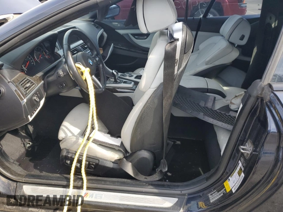 2015 BMW M6 with VIN WBSLZ9C59FD651474, listed as a Copart auction lot 60882454 with Not provided miles and Salvage title. Bid and sale history available at DreamBid. Image 7.