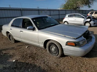 2000 Ford Crown Victoria with VIN 2FAFP73W5YX181565, listed as a Copart auction lot 77098594 with 180,439 mi miles and Salvage Title. Bid and sale history available at carsss.com. Image 4.