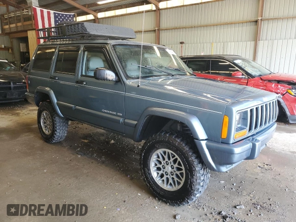 1998 Jeep Cherokee Country with VIN 1J4FT78S8WL252502, listed as a Copart auction lot 59664545 with 133,148 mi miles and Salvage title. Bid and sale history available at DreamBid. Image 4.