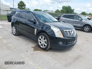 2015 Cadillac SRX Performance Collection z VIN 3GYFNCE31FS597798, wystawiony jako IAAI lot #42387793 z przebiegiem 159 986 mil mil oraz . Historia ofert i sprzedaży dostępna na DreamBid. Obrazek 1.