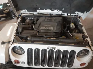2012 Jeep Wrangler Arctic z VIN 1C4AJWBG9CL233232, wystawiony jako IAAI lot #42282805 z przebiegiem 109 927 mil mil oraz . Historia ofert i sprzedaży dostępna na DreamBid. Obrazek 10.