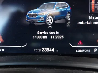 2021 BMW X5 sDrive40i with VIN 5UXCR4C01M9F02587, listed as a IAAI auction lot 41111144 with 23,844 mi miles. Bid and sale history available at carsss.com. Image 7.