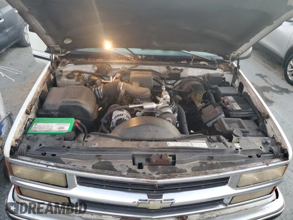 1996 Chevrolet Suburban z VIN 3GNFK16R7TG124404, wystawiony jako Copart lot #77361264 z przebiegiem 256 935 mil mil oraz Szkoda całkowita • Salvage title. Historia ofert i sprzedaży dostępna na DreamBid. Obrazek 12.