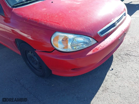2002 Kia Rio with VIN KNADC123126182360, listed as a IAAI auction lot 41526651 with 82,052 mi miles. Bid and sale history available at carsss.com. Image 6.