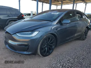2023 Tesla Model X with VIN 7SAXCAE5XPF384061, listed as a Copart auction lot 86834084 with 6,974 mi miles and Salvage Title. Bid and sale history available at DreamBid. Image 1.